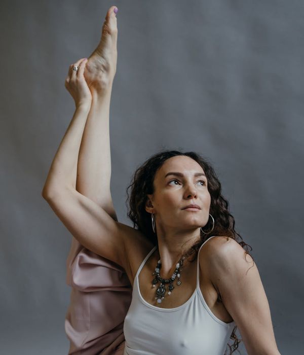 A person in a calm, balanced pose after a workout, feeling serene.
